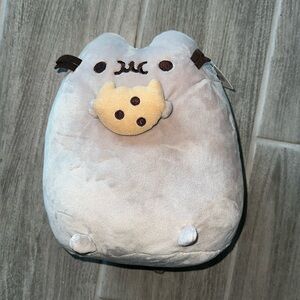 I am selling ny cute pusheen plush holding a cookie, its brand new basically